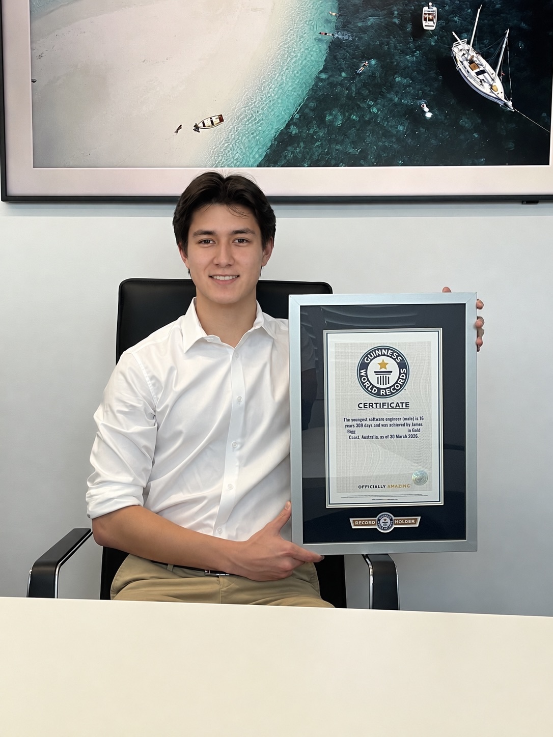 James Bigg holding his Guinness World Records certificate
